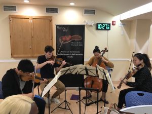 NEC students performing at the Women's Lunch Place